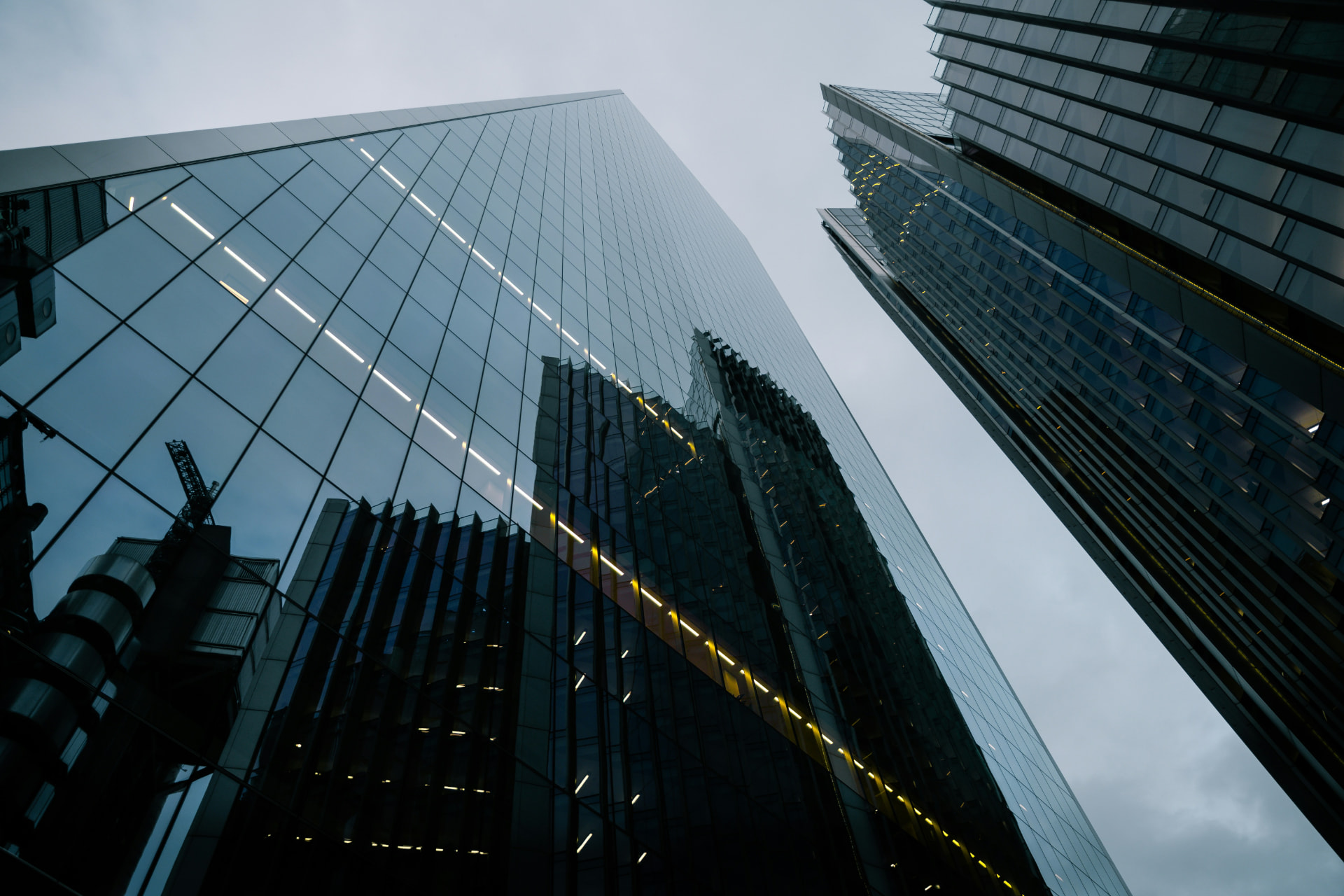 Modern glass towers rising into the sky, symbolizing the strong foundation Hydrogen Capital builds for growth, acquisitions, and capital decisions